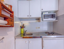 cabinet, sink, indoor, countertop, home appliance, cabinetry, kitchen, tap, bathroom, plumbing fixture
